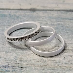 Three White Enamel Ring Set.